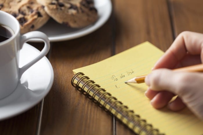 Woman filling out estate planning checklist