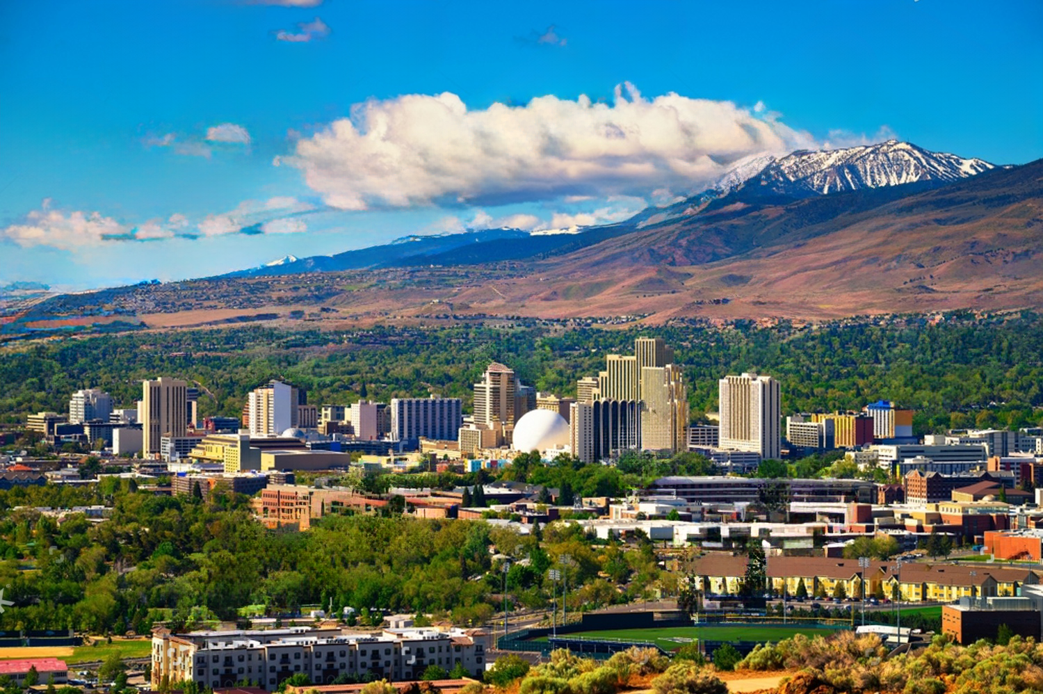 -reno-skyline-nevada-with-hotels-casinos-and-the-surrounding-high-eastern-sierra-2185549997